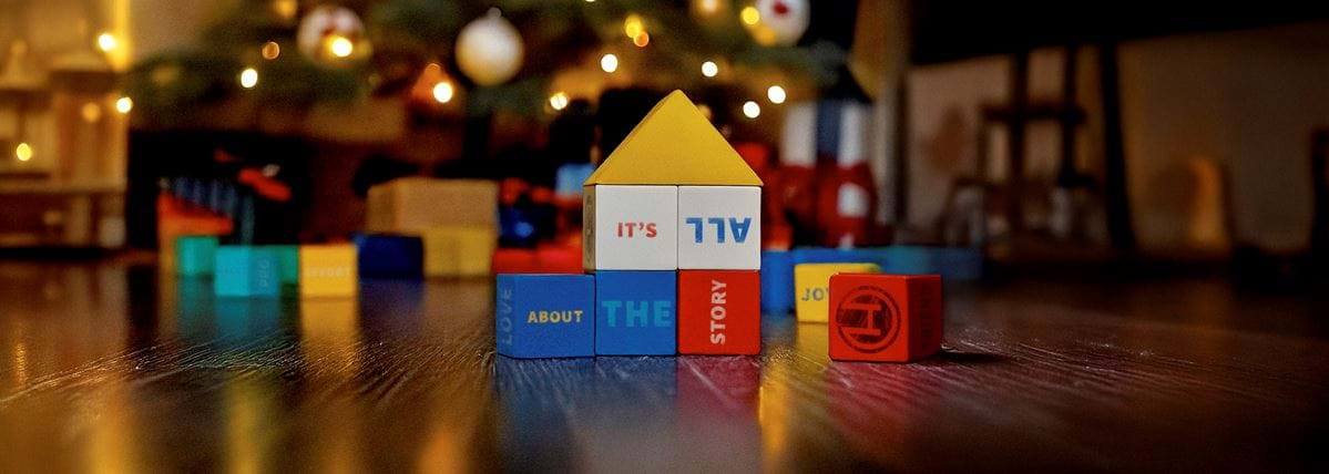 Hindenburg Systems | Kids Blocks | Bricks | with Words on Creating It Is All About The Story in Christmas Theme Living Room