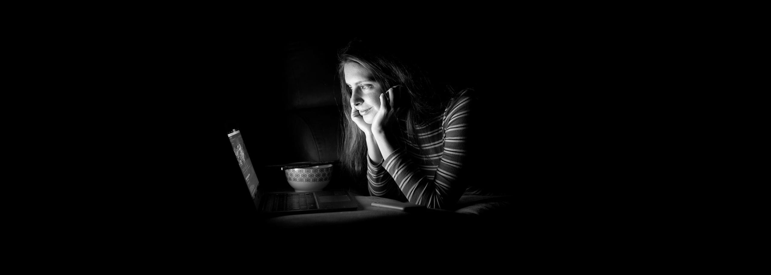 Reading the Hindenburg storytelling blog on a laptop at night