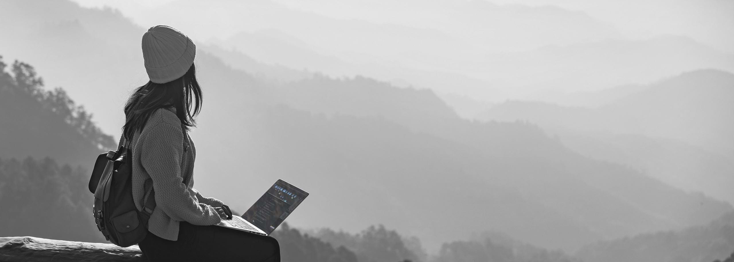 A journalist editing audio offline in Hindenburg Pro while working outdoors in the mountains. Hindenburg enables professional audio storytelling anywhere in the field, even without internet access.