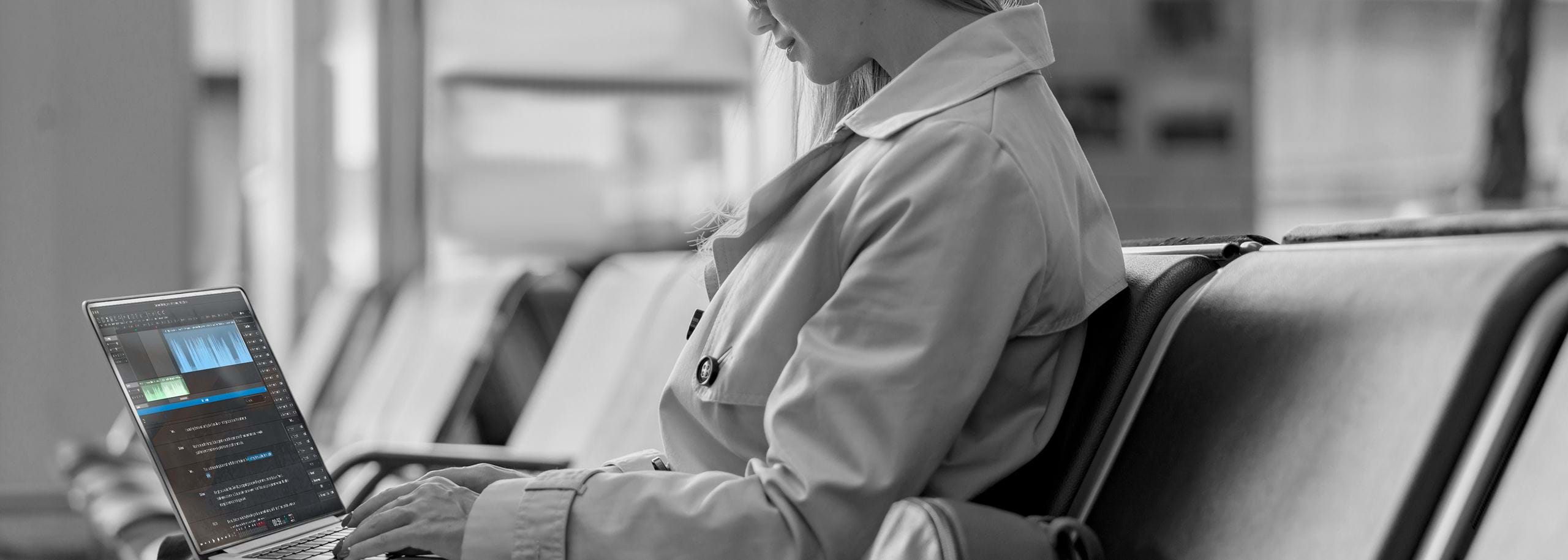 At an airport boarding area, a journalist continues editing an audio story in Hindenburg Pro. Built for field work, the software allows professional audio storytelling even without internet access.