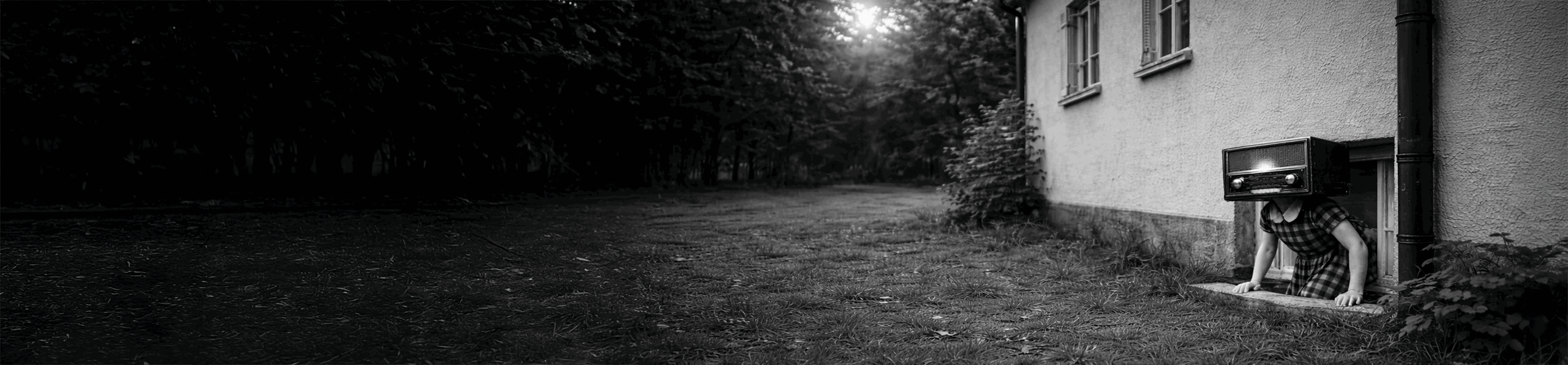 Child with a vintage radio for a head climbing out of a basement window beside a house in a dark outdoor setting