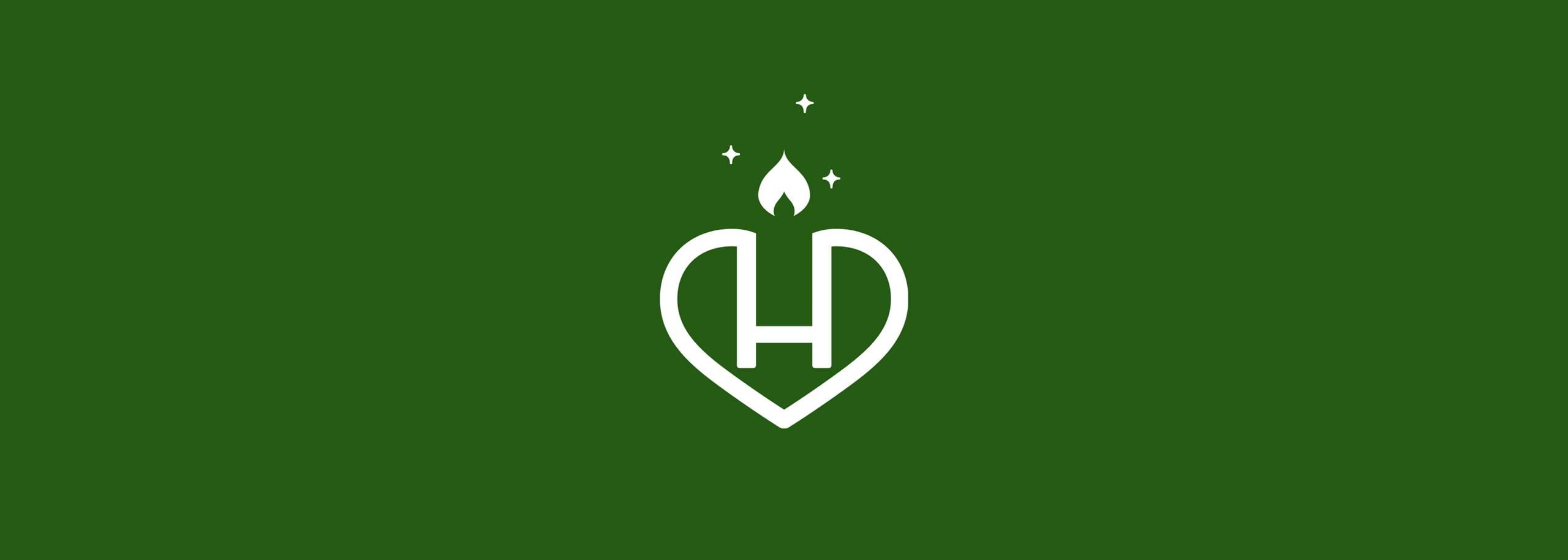 White Hindenburg logo shaped like a heart with a stylized “H” inside, topped by a small flame and star-like sparkles, set against a solid deep green background.